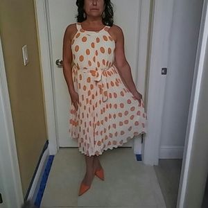 White dress with orange pocka dots